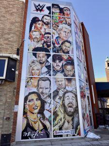 Local artist JD Bills painted a mural featuring past and present WWE superstars who have participated in the Royal Rumble Match. For more on JD Bills visit his website at https://www.JDBills.com/.