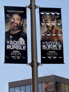 Throughout the downtown area, advertisements for "WWE Royal Rumble 2025" hung on the light posts and featured various WWE Superstars.