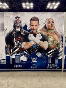 A graphic of Penta, "The Best in the World" CM Punk, and Tiffany Stratton.