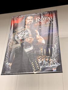 The poster for "WWE Royal Rumble 2016" hung above the superstore.