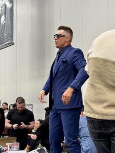The Miz arrives at the WWE/Fanatics auction table.